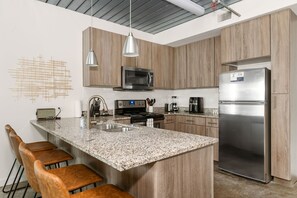 Prepare delicious meals in this modern kitchen with all the essentials.