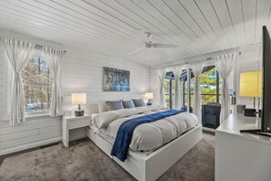 Master Bedroom w/ King Bed, television, and direct access to sunroom