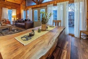 Dine in rustic elegance at the beautiful live-edge table.