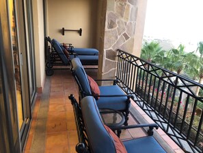 Balcony has 2 sitting areas and a breathtaking view of the ocean. 