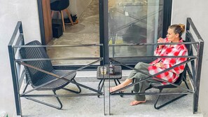 Enjoy a moment of tranquility on your private balcony.