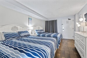 Primary bedroom with two queen beds