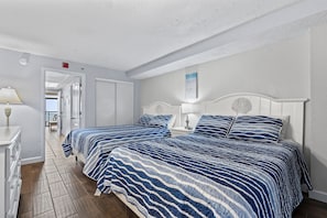 Primary bedroom with two queen beds