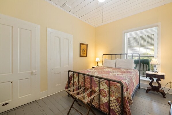 Room 33 has a queen bed, small ensuite and a door to the shared deck area