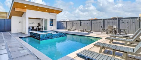 The spacious pool and spa can be heated in cooler months