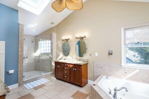Walk in shower & jacuzzi tub awaits you after a long day at the beach.