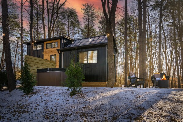 exterior view of fire pit + hot tub