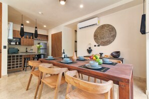Gather around the stylish dining table for meals, work, or great conversation