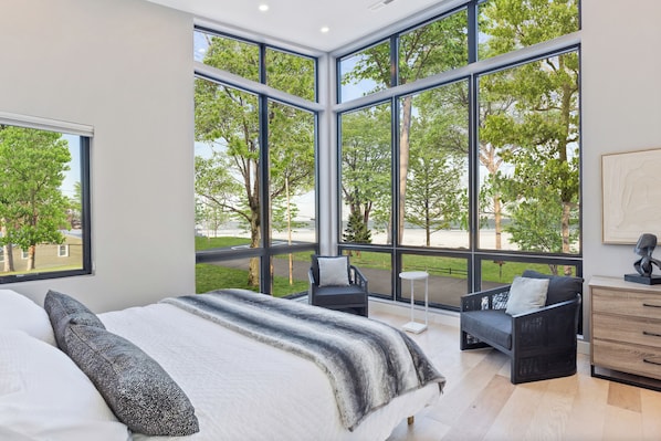 Primary bedroom with king bed and gorgeous lake views