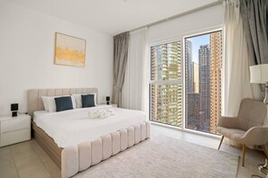 Luxury Bedroom: Experience upscale living with panoramic city views and elegant modern design!