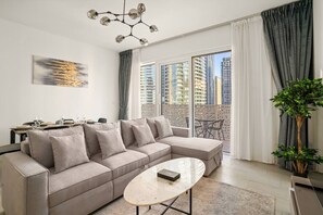 Living Room: Enjoy breathtaking views of Dubai from your stylish, sunlit retreat!