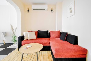 Relax in the stylish living room, where the cozy seating area invites you to unwind after a day of exploring Sofia.