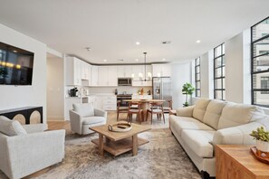 Spacious Living Room with Comfortable Seating + Smart TV