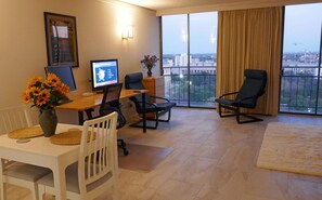 The studio in the evening. Italian floors, six foot desk, office chair and more.