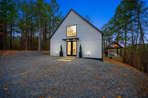 Getaway to this stylish A-frame cabin, where modern design meets cozy charm. Nestled in nature, this retreat offers sleek interiors, stunning views, and the perfect blend of comfort and adventure.