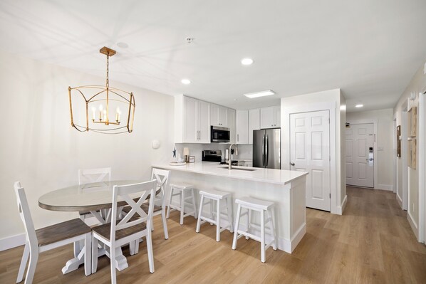 Dining room table and 3 bar stools.