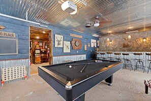 Dockside Manor: game room with bar, arcade, shuffleboard, and pool table