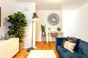 Living Room: Sun-drenched comfort with rich textures and soft, ambient lighting throughout