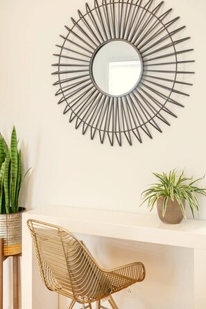 Living Room: Soft curves and organic accents come together to form a serene, eye-catching focal point