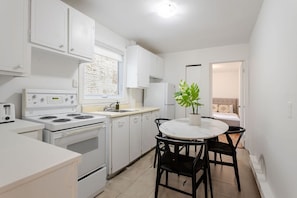 Fully equipped kitchen with dining table for four