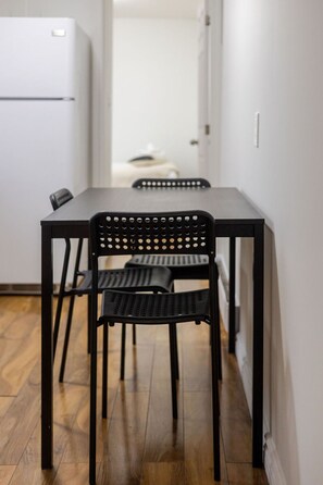 Simple, modern dining area—perfect for meals or a laptop workspace.