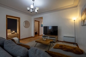 Warm lighting creates a cozy nighttime vibe in the living space