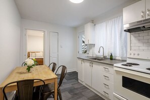 Clean, modern kitchen with dining space for home-cooked meals.