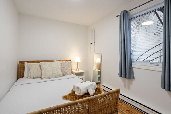 Bedroom #1 : Chic and serene bedroom with natural textures and soft lighting.