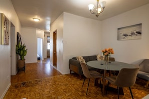 Spacious layout with a view from the hallway into the inviting living and dining area