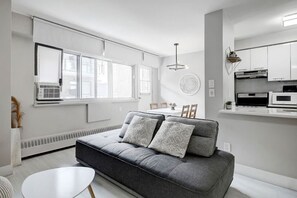 This bright and modern living space is perfect for unwinding after a day exploring Montreal.