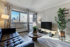 A bright and stylish living space with a sleek leather sofa