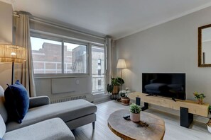 enjoy natural light, a comfy lounge, and a private balcony view in the heart of Montreal.