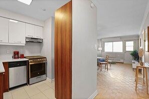 A modern and functional layout featuring a fully equipped kitchen and a bright