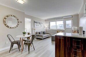 An open-concept layout blending the dining and kitchen areas, perfect for a comfortable and social stay