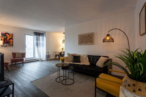 Spacious living area with chic decor and natural light