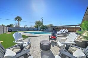 Day Bed, Fire Pit and Adirondack Chairs NOT PICTURED: - Large 11ft, easy use Umbrella for shade - Exercise equipment - yoga mats, 5-50lb dumbells