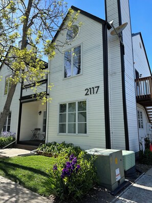 Second floor condo with private south facing balcony with views of green space.