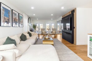 Main living room with a cloud sectional that can seat 8 comfortably
