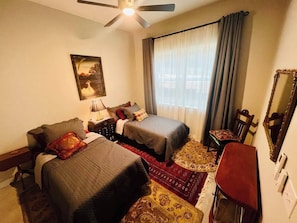 This downstairs bedroom is another cozy nest with extra wide doors and a lovely view of the lake. Easily converted to a king bed upon request. Right next to a full bathroom for maximum convenience.