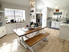 The dining area can seat up to 10 people. Additional chairs are available. 