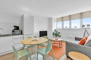 Open-plan kitchen and dining area with modern appliances