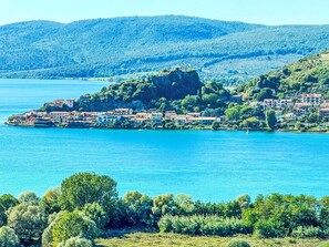 Blue, Water, Body Of Water, Mountainous Landforms, Water Resources, Mountain, Natural Landscape, Hill, Coastal And Oceanic Landforms, Bank
