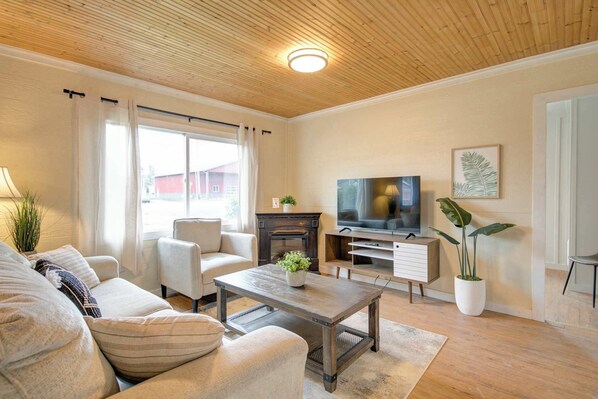 Cozy up in this spacious living area, where relaxation meets modern comfort.