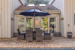 Back yard with private pool, outdoor seating, and grill