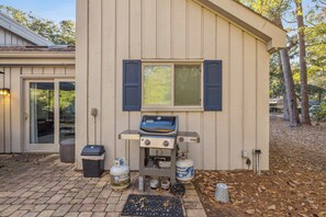 Back yard with private pool, outdoor seating, and grill