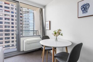 Delight in casual meals or quick bites at the round table for two, ideal for peaceful dining moments.