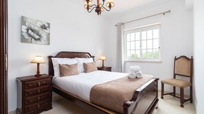 This sophisticated bedroom exudes charm with vintage-style furniture and warm, inviting accents. #ClassicComfort #RelaxInStyle