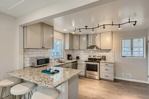 Prepare a quick snack or a large dinner in fully equipped modern kitchen.