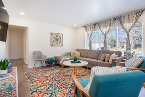 Relax in the bright, comfortable upstairs living room with family and friends.