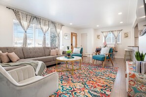 Relax in the bright, comfortable upstairs living room with family and friends.